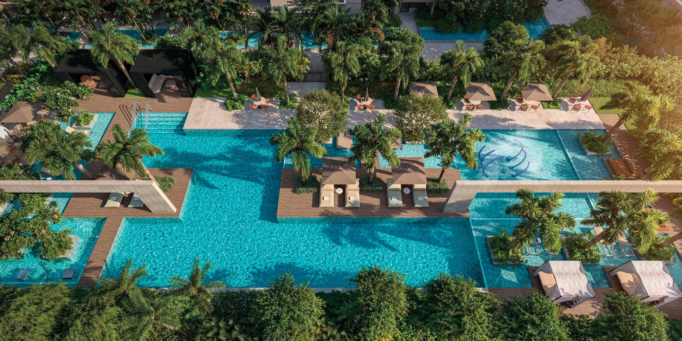 Perspectiva aérea das piscinas do ON Resort, com decks e jardins tropicais